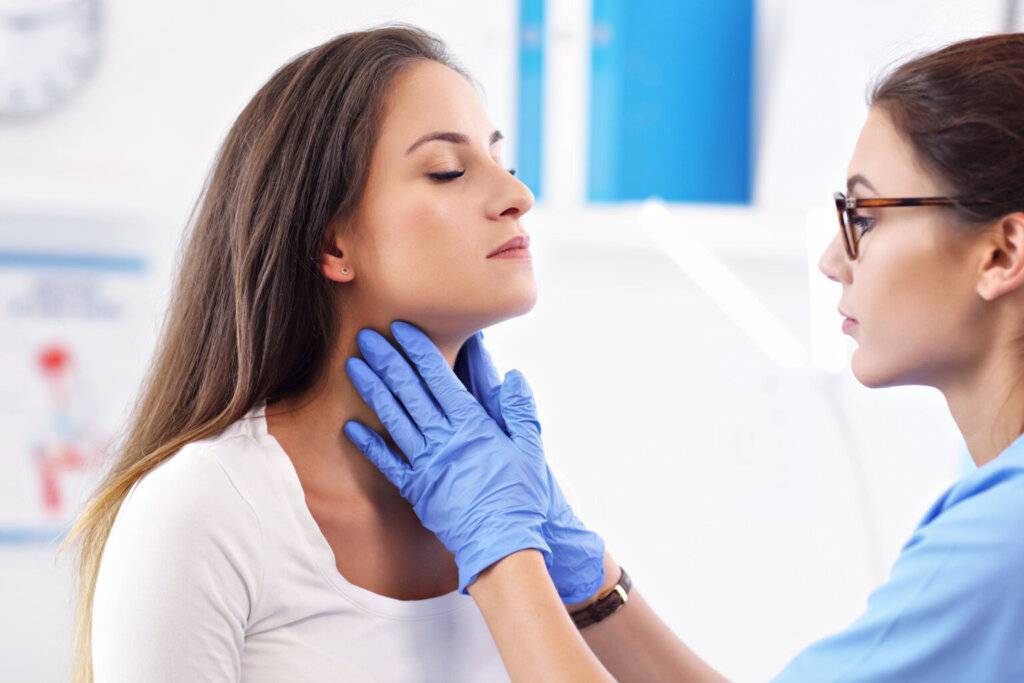 Adult woman having a visit at female doctor's office